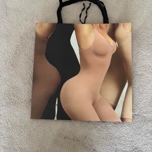 Skims 16x16 Tote Bag